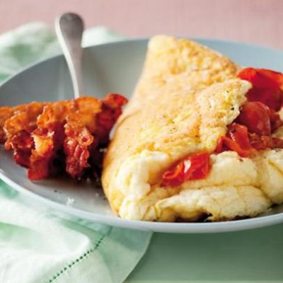 Traditional six-egg omelette with crisp bacon and panfried cherry tomatoes