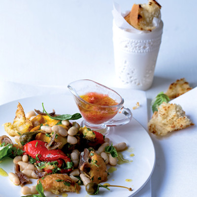 White bean panzanella salad with tomato dressing, caperberries and anchovies