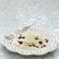 White organic chocolate carpaccio with creme fraiche, toasted hazelnuts and pink peppercorns