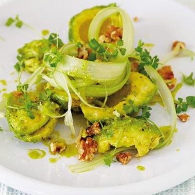 Zesty avocado salad with roasted walnuts, celery and mustard cress sprouts