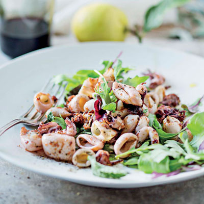 Lemony squid with baby leaves and bruschetta | Woolworths TASTE