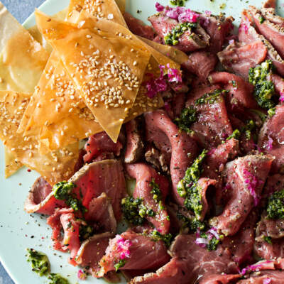 Beef carpaccio with coriander, chilli and lime pesto and phyllo sesame chips