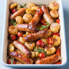 Pork sausages, sweet tomato and potato tray bake