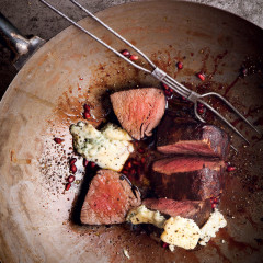 Fillet steak in tangy pomegranate sauce with blue cheese