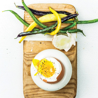 Soft-boiled eggs with garlicky beans