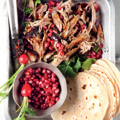 Asian-style duck pancakes with sticky sauce and pomegranate rubies