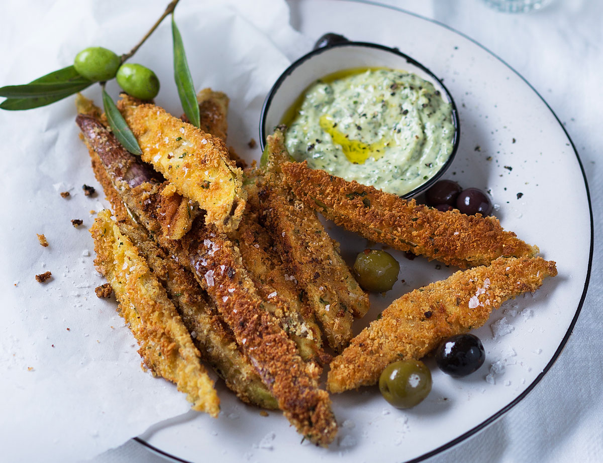 Parmesancrumbed brinjal with marinated olives and basil pesto mayo