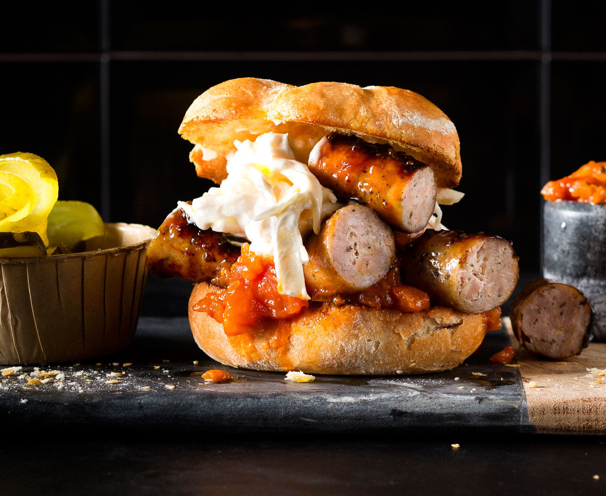 Spring onionandfeta pork sausage burger with relish and