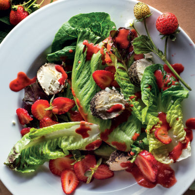 Green salad with strawberries and strawberry balsamic vinaigrette