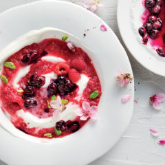 Blueberries stewed in hibiscus tea with raspberry-swirl yoghurt