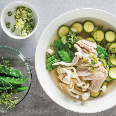 Wholesome quick chicken broth with poached chicken