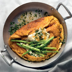 The ultimate soufflé omelette with chive crème fraîche and asparagus