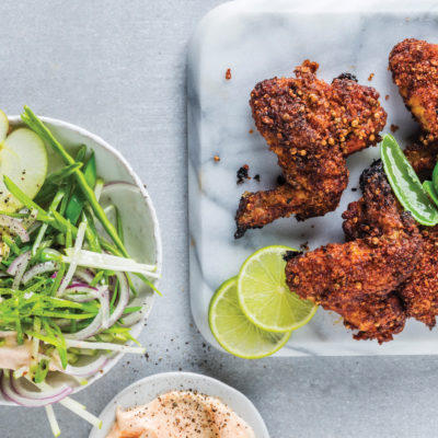 Crispy chicken wings with apple-and-red onion slaw and sriracha mayo