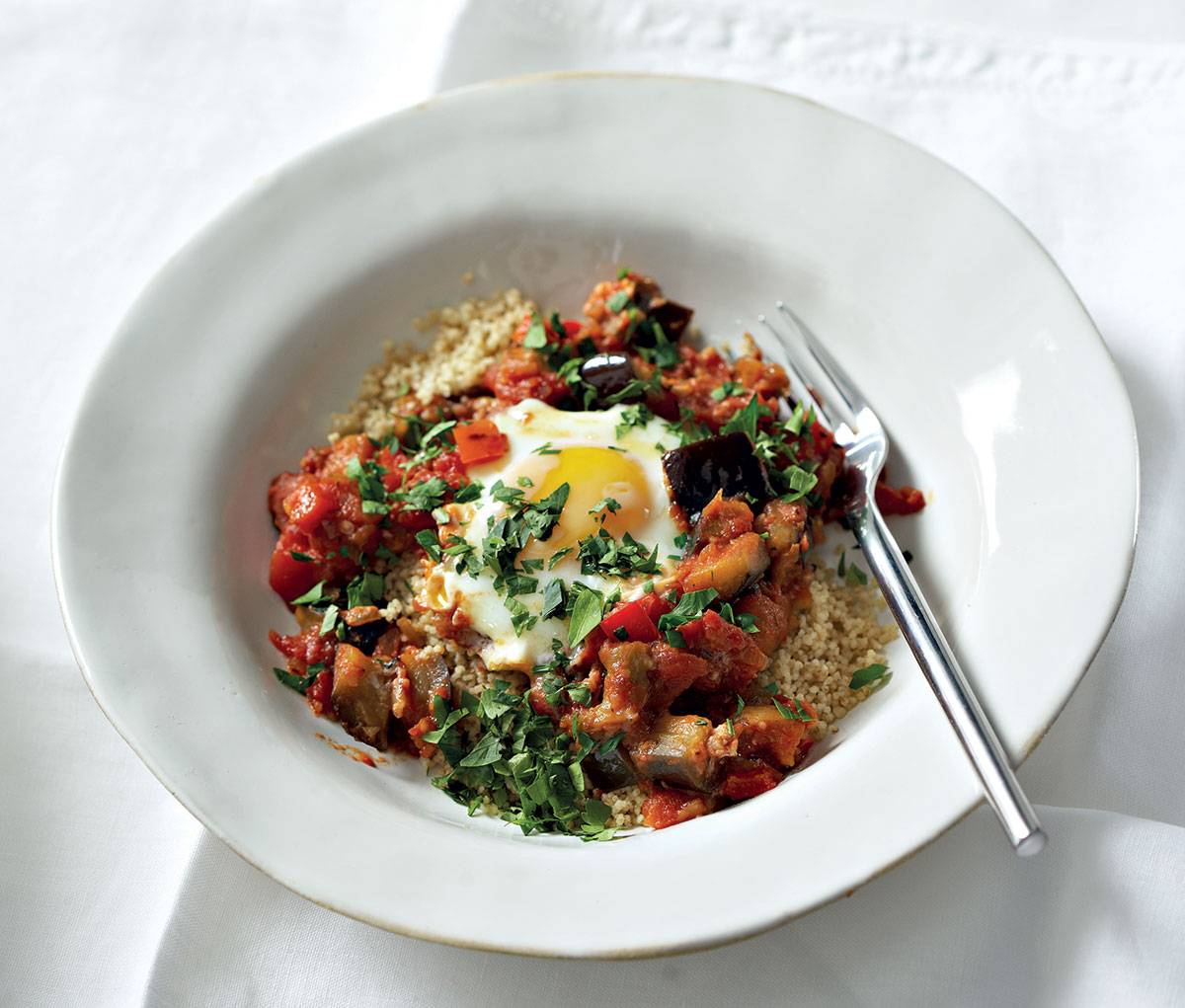 Spicy poached eggs with pepper, brinjal and tomato | Woolworths TASTE