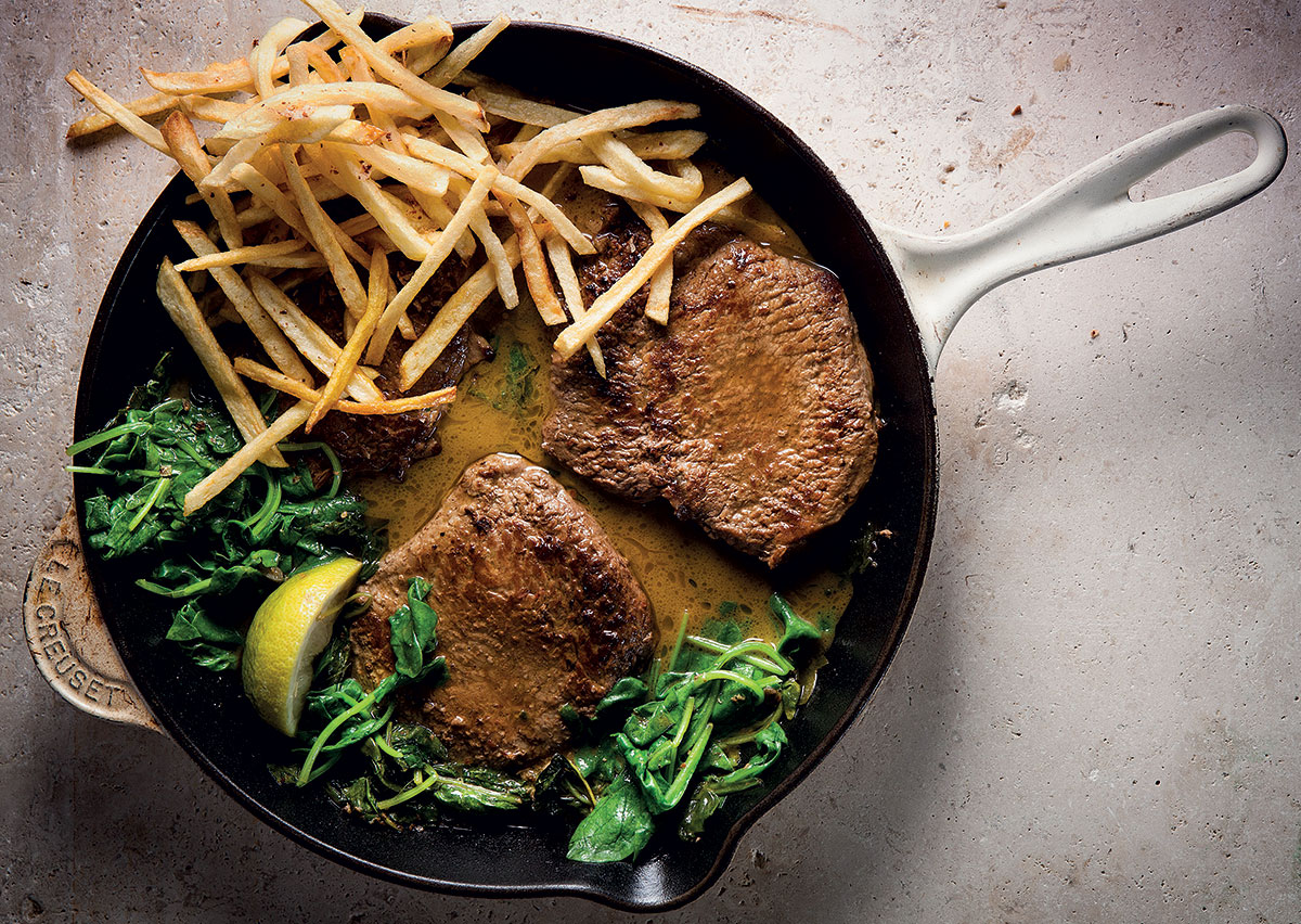steak with anchovy-spinach sauce and matchstick fries