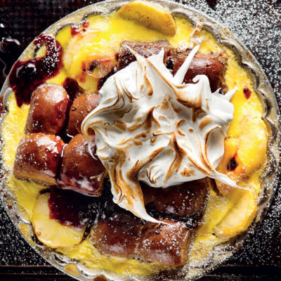 Bread pudding with apples, blueberry jam and meringue