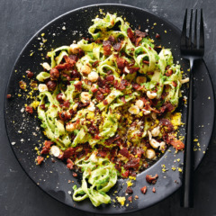 Tagliatelle with mint pea purée, toasted hazelnuts, bacon and cured egg yolk