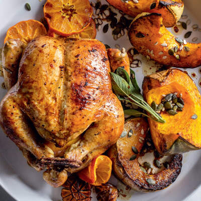 Sticky ClemenGold-glazed roast chicken with pumpkin wedges