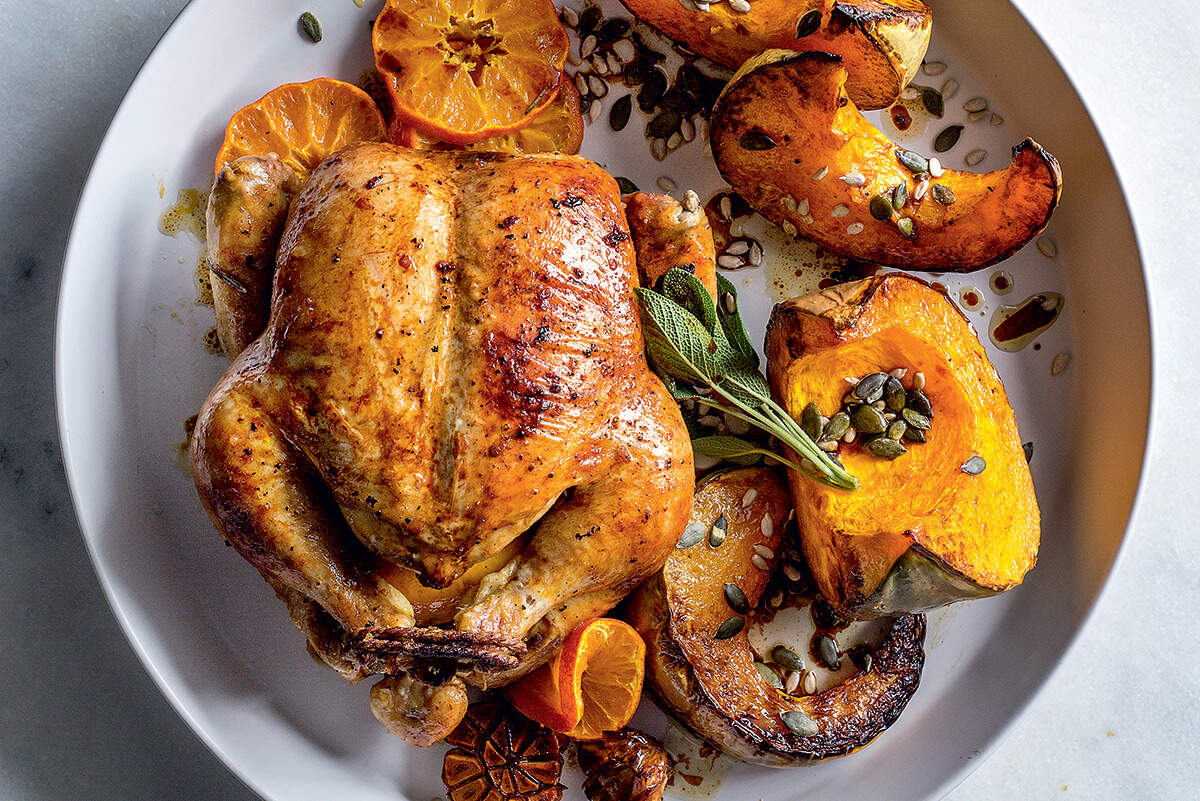 Sticky ClemenGold-glazed roast chicken with pumpkin wedges recipe