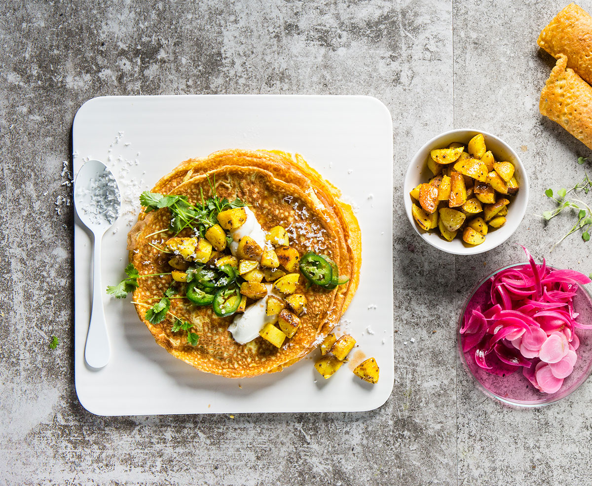 Omelette wraps filled with spicy coconut-fried potato | Woolworths TASTE