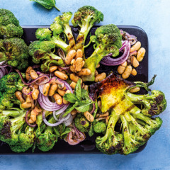 Grilled broccoli steaks with white beans, red onions and anchovy butter