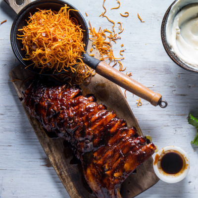 Supersized tender pork ribs with sweet potato fries