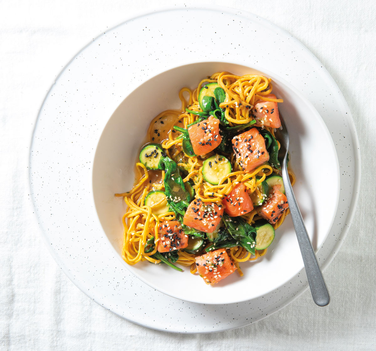 These trout bites with seafood noodles are a light, convenient supper
