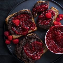 Home-made chocolate hazelnut spread and raspberry jam on toast