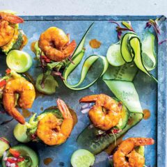 Spicy prawns and guacamole in cucumber cups