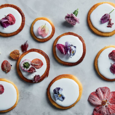 Condensed milk cookies with royal icing and edible flowers
