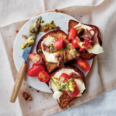 Anchovy on toast with fresh tomato and parsley butter