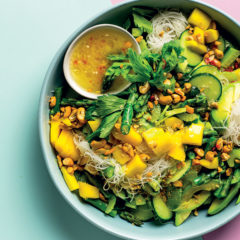 Cold Asian salad with noodles, cucumber, avocado and mango