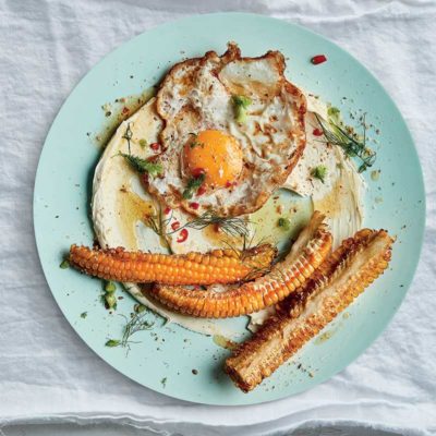 Fried eggs in brown butter with labneh and corn 