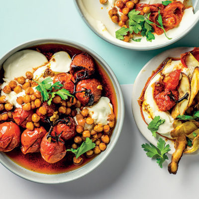 Potato skins with cold blistered tomatoes, yoghurt and chilli chickpeas