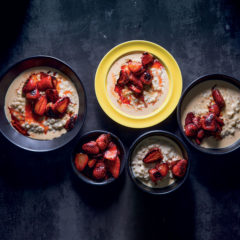 Creamy barley vanilla porridge with roast strawberries and evaporated milk
