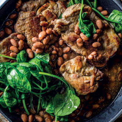 Marinated porks steaks with beans and spinach