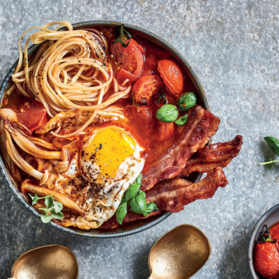 Breakfast egg noodle bowls with fried eggs, bacon, roast tomatoes and mushrooms