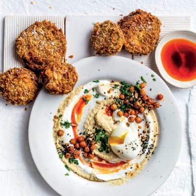Soft-boiled Turkish-style eggs with hummus, labneh, crumbed brinjal and paprika oil