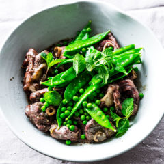 Marinated lamb knuckles with peas, mint and lemon