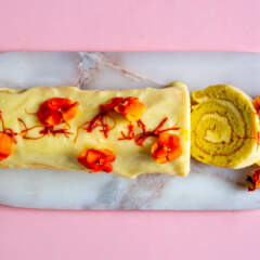 Saffron Swiss roll with whipped cardamom cream