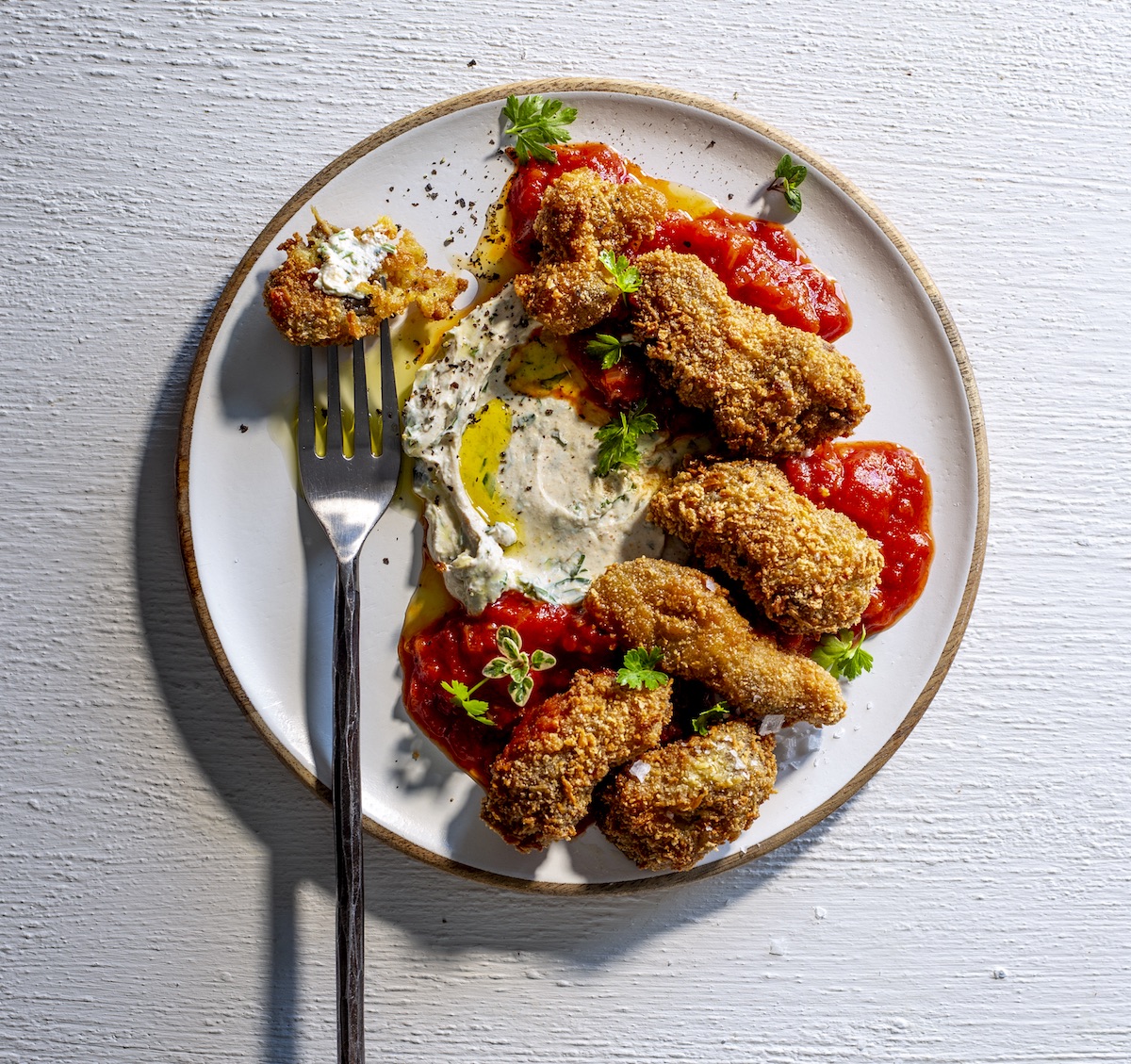 Izingingila namasi (Deep fried chicken gizzards, with spiced amasi and