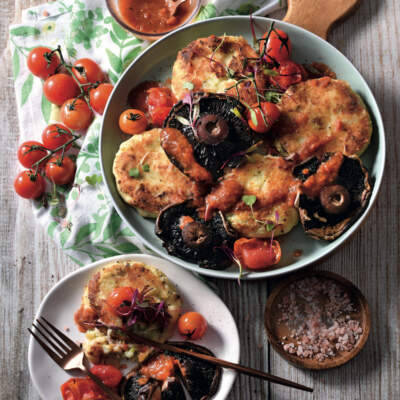 Potato cakes with tomatoes and mushrooms
