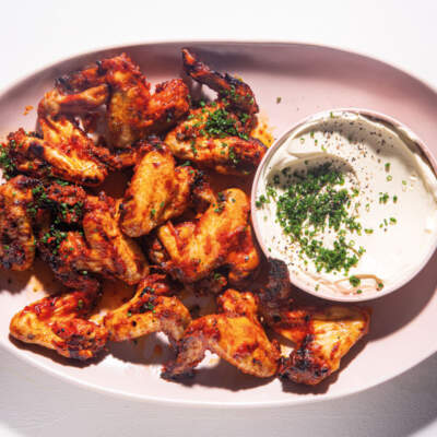 Sticky red pepper chicken wings with sour cream sauce