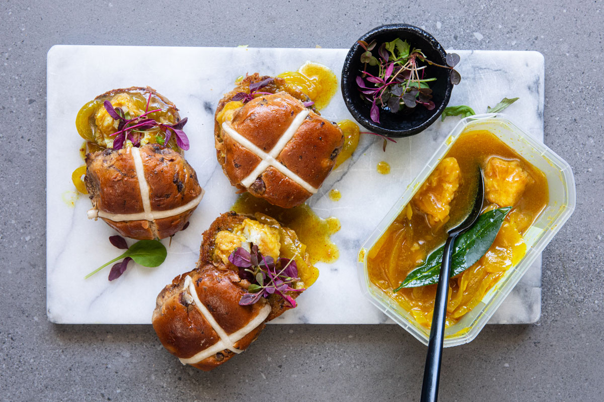 Hot cross buns with pickled fish 
