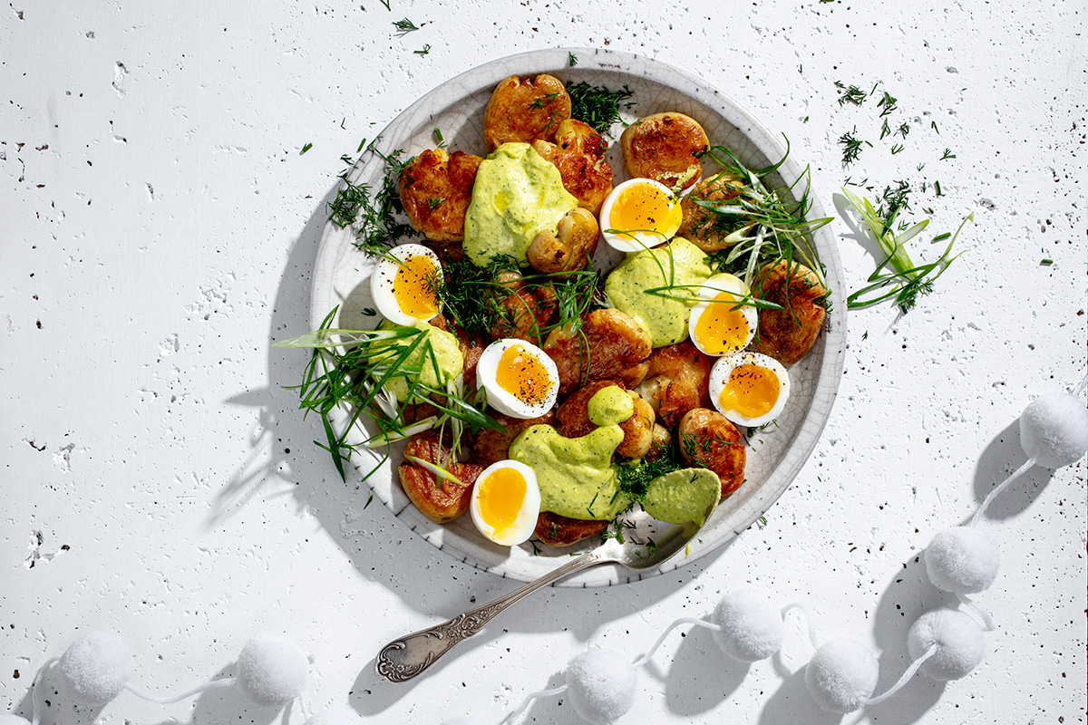 Roast potatoes with devilled egg dressing