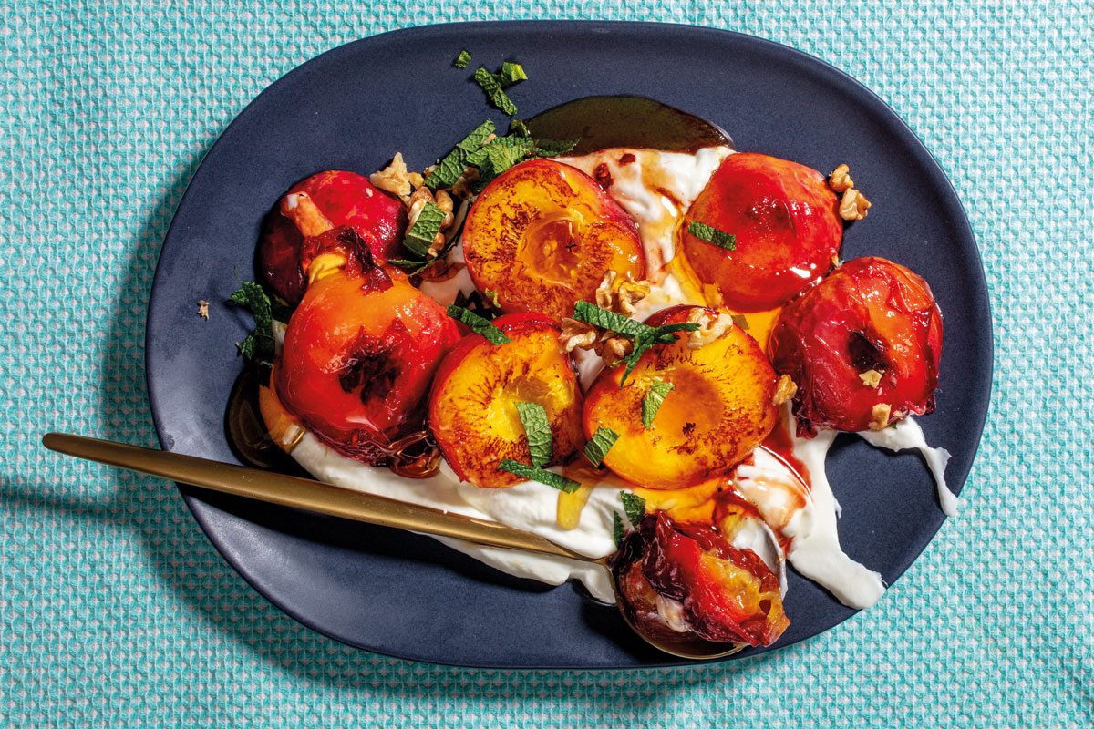 Roasted nectarines with walnuts, chilli, honey and mint on yoghurt