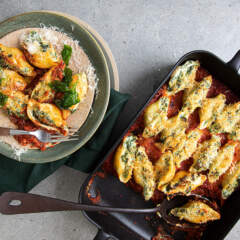 Baked conchiglie stuffed with spinach and ricotta