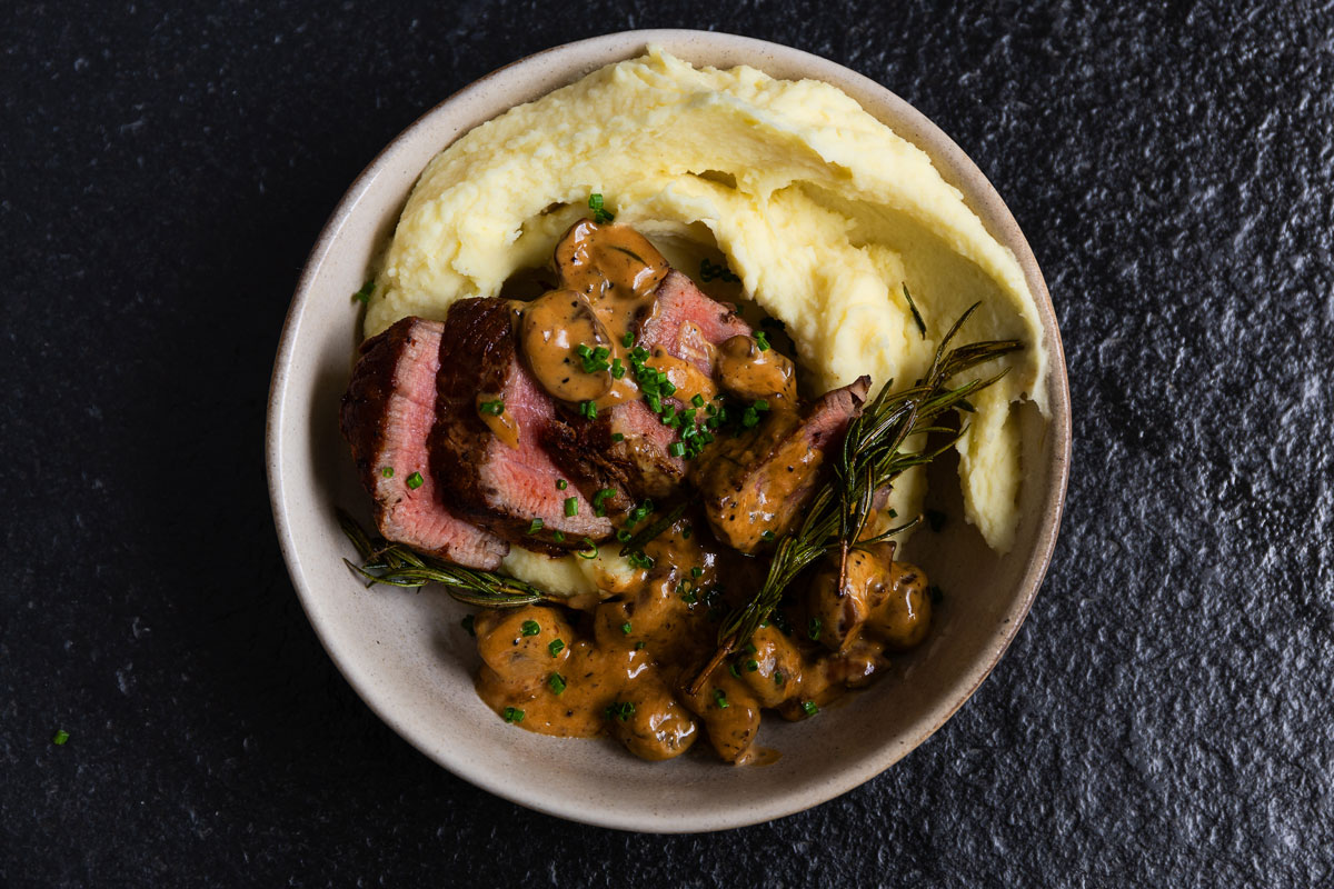 Fillet steak with a quick peppered mushroom sauce Woolworths TASTE