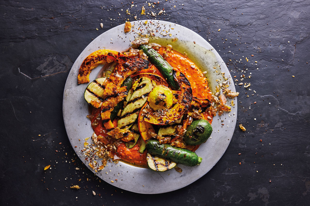 GRILLED SQUASH WITH APRICOT HARISSA AND SEED BRITTLE