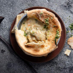 Baked chicken soup pie with flatbread topping